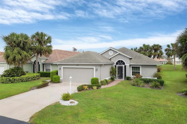 single story home with a garage and a front lawn