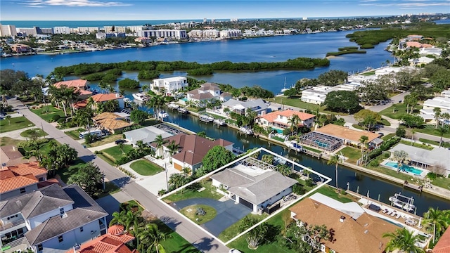 aerial view of residential area featuring property parcel outlined and a nearby body of water