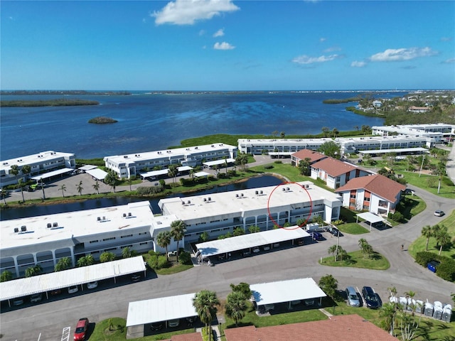 birds eye view of property with a water view