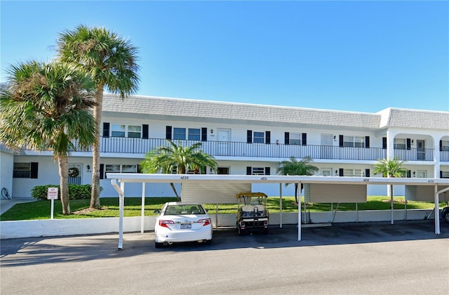 view of property featuring covered parking