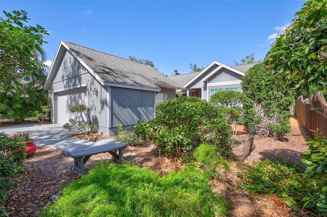 view of side of property with a garage