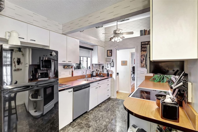 kitchen with sink, stainless steel dishwasher, a textured ceiling, and white cabinets