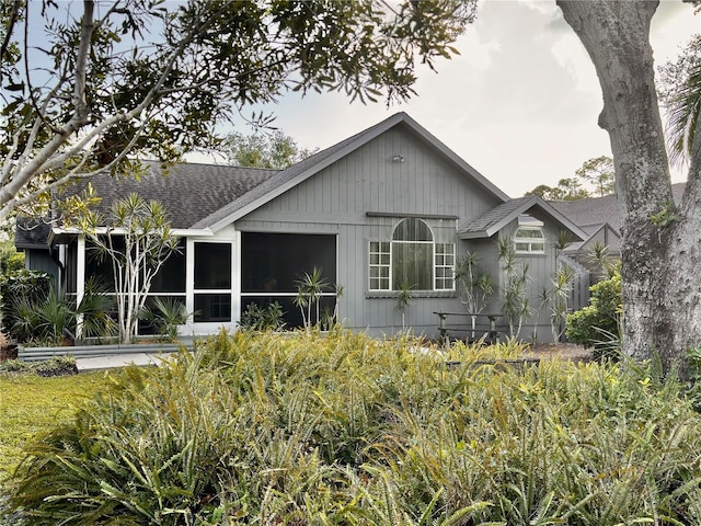 rear view of house with a sunroom