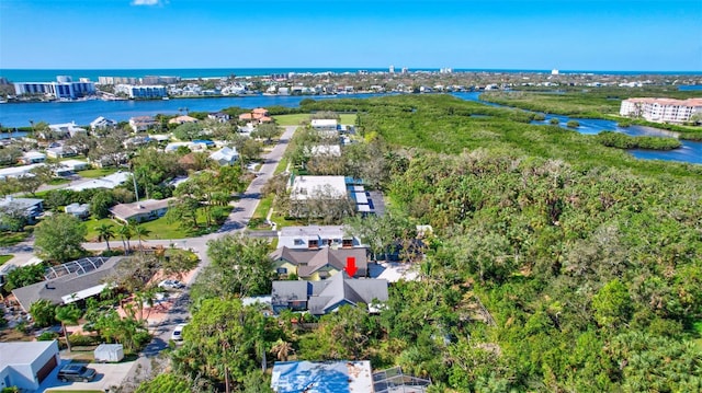 birds eye view of property with a water view