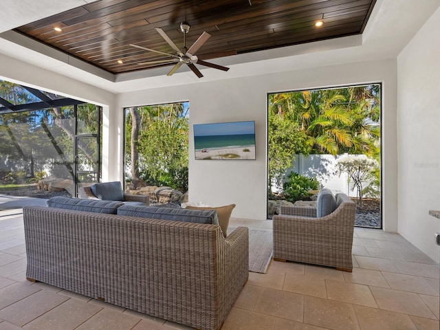 view of patio / terrace with outdoor lounge area, ceiling fan, and a lanai