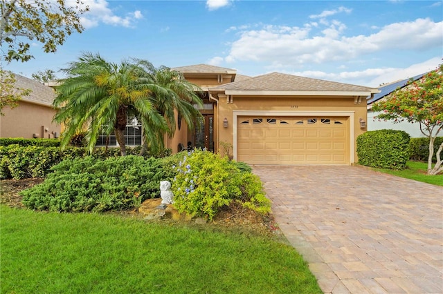 view of front of property with a garage