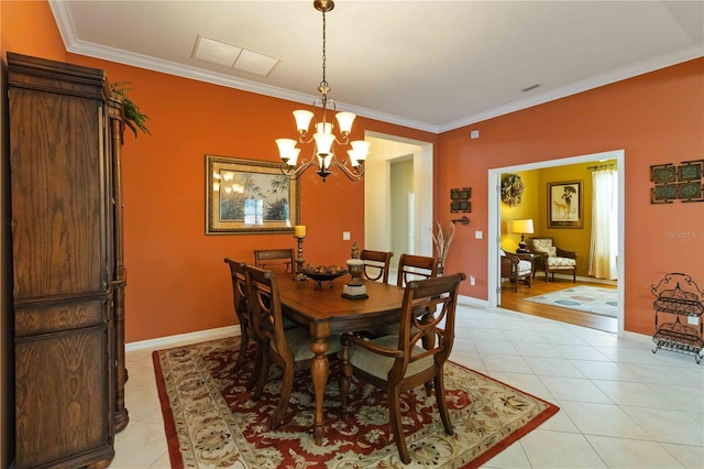 tiled dining space with crown molding and a chandelier