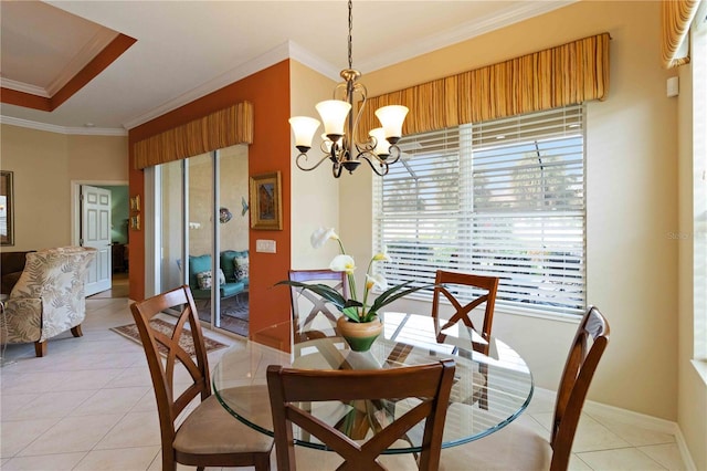 dining room featuring crown molding, light tile patterned flooring, and a chandelier