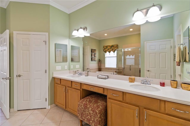 bathroom featuring tile patterned floors, vanity, a shower with door, and crown molding