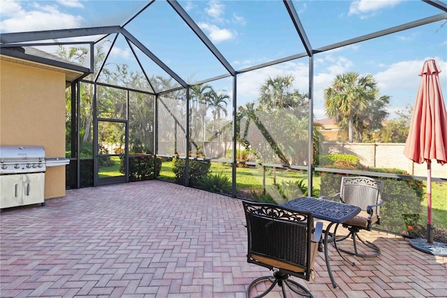 view of patio / terrace featuring a lanai and a grill