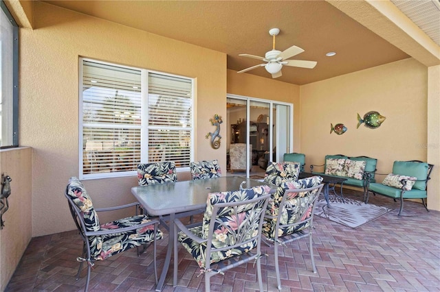 view of patio / terrace with ceiling fan and an outdoor hangout area