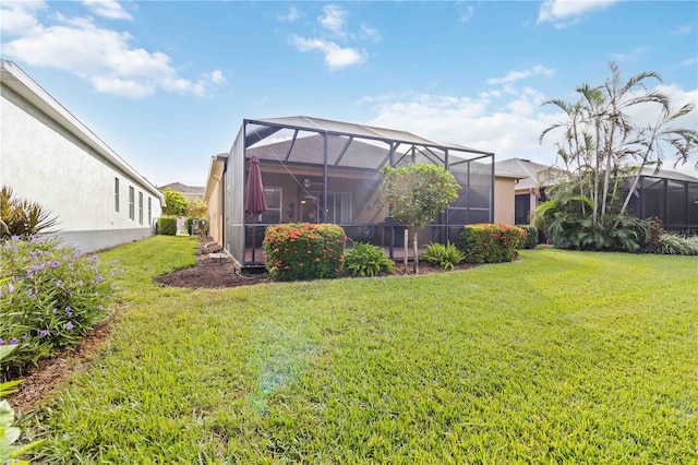 view of yard with a lanai