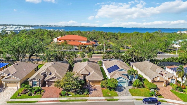 birds eye view of property with a water view