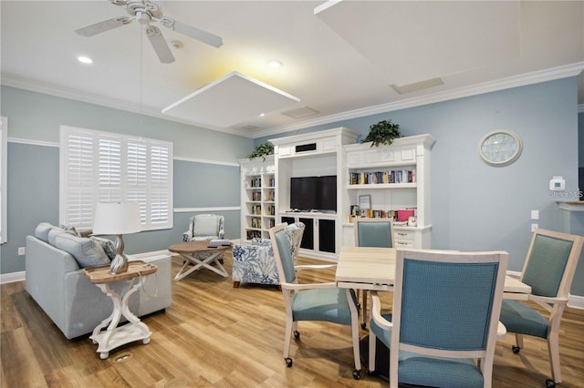 dining space featuring crown molding, ceiling fan, and hardwood / wood-style flooring