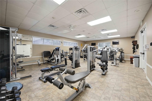 workout area featuring a paneled ceiling