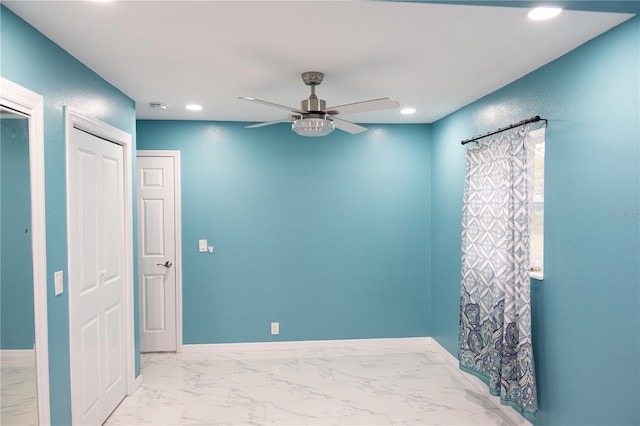 spare room featuring ceiling fan