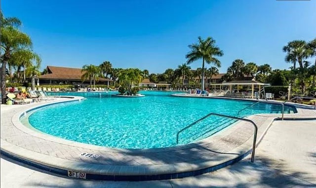 view of swimming pool featuring a patio