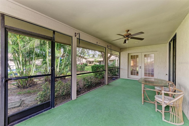 unfurnished sunroom with plenty of natural light and ceiling fan