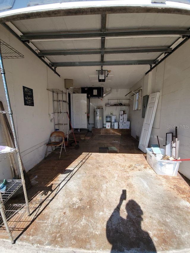 1308 72nd St E, Palmetto, FL 34221 - garage with electric water heater and a garage door opener