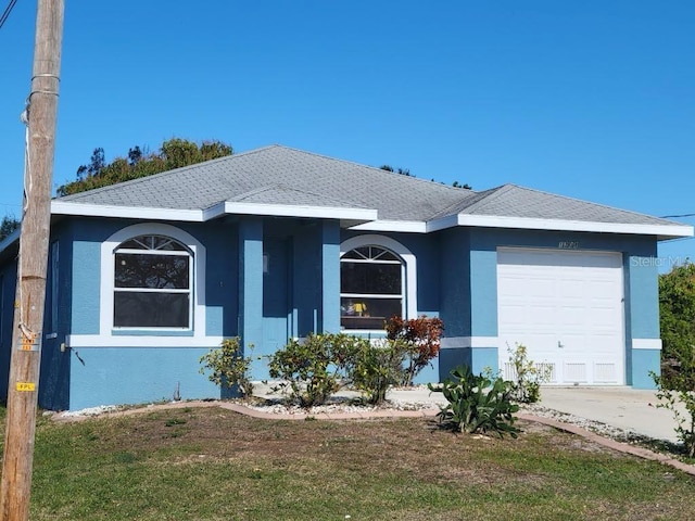 1308 72nd St E, Palmetto, FL 34221 - single story home featuring an attached garage, stucco siding, and concrete driveway