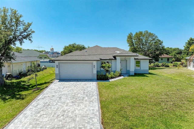 view of front of property featuring a garage and a front yard