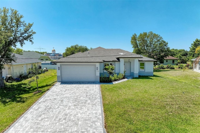 7648 Totem Ave, North Port, FL 34291 - view of front of property with stucco siding, a front lawn, decorative driveway, and an attached garage