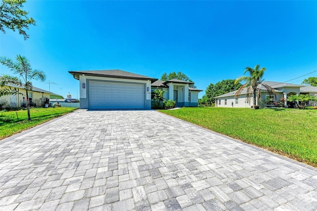 7648 Totem Ave, North Port, FL 34291 - view of front of property featuring decorative driveway, a garage, a front yard, and stucco siding