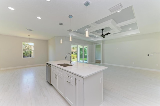 7648 Totem Ave, North Port, FL 34291 - kitchen with open floor plan, coffered ceiling, stainless steel dishwasher, ceiling fan, and an island with sink