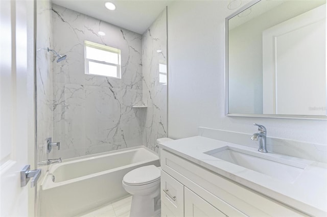 full bathroom featuring toilet, tiled shower / bath combo, vanity, and tile patterned floors