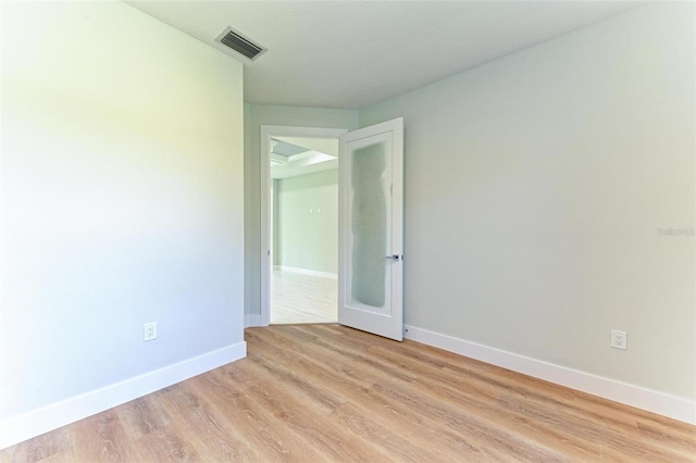 spare room with light wood-type flooring