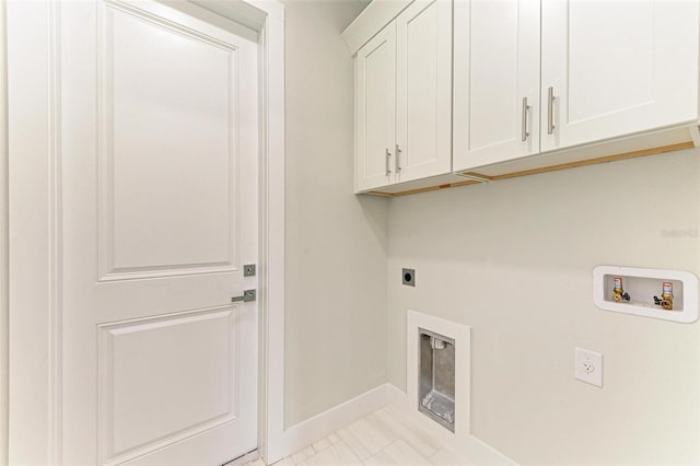 washroom with cabinets, hookup for a washing machine, and electric dryer hookup