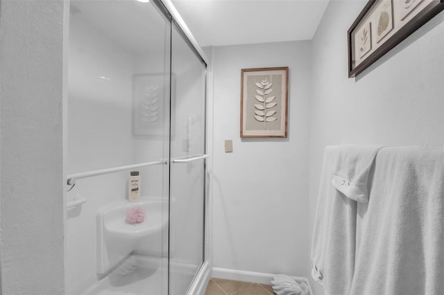 bathroom featuring tile patterned flooring and walk in shower