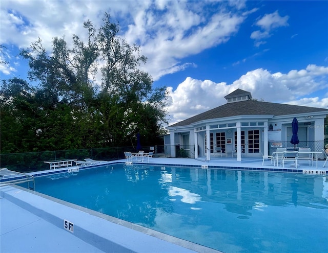 view of swimming pool with a patio area