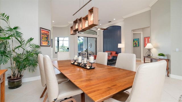 dining room featuring light tile patterned floors, ceiling fan, and ornamental molding