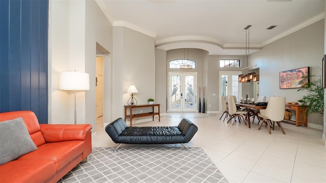 tiled living room featuring french doors and crown molding