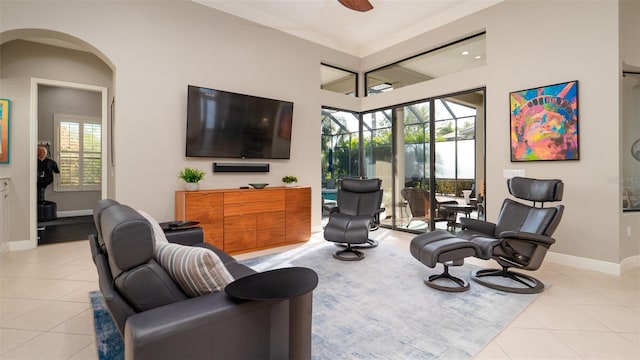 living room featuring ceiling fan and light tile patterned floors