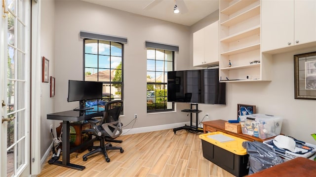 office featuring light hardwood / wood-style flooring and ceiling fan