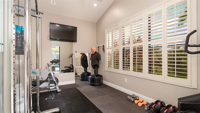 exercise room featuring lofted ceiling