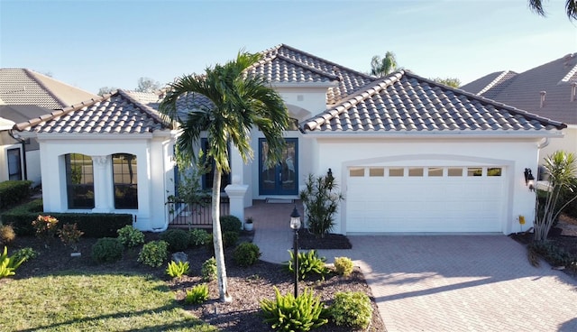 mediterranean / spanish-style house featuring a garage