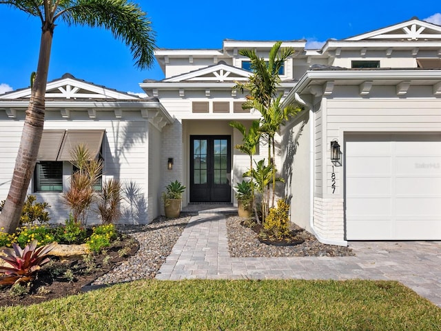 view of front of house with french doors and a garage