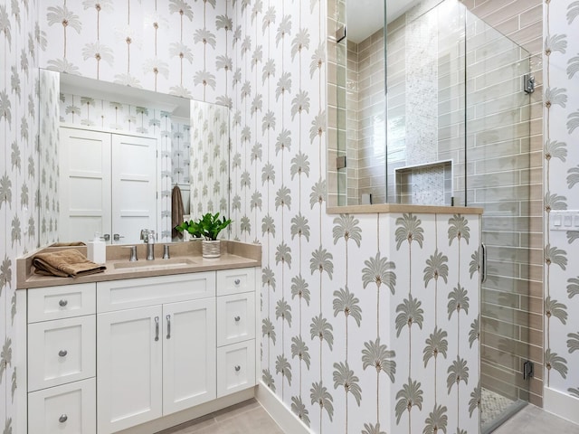 bathroom with vanity and walk in shower