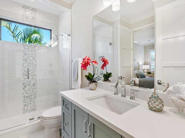 bathroom with toilet, an enclosed shower, ornamental molding, and vanity