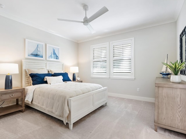 bedroom with ceiling fan, light carpet, and ornamental molding