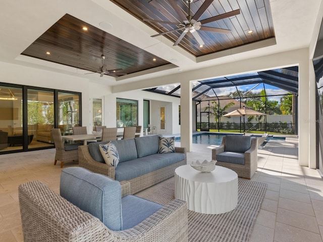 view of patio featuring ceiling fan, a lanai, and an outdoor hangout area