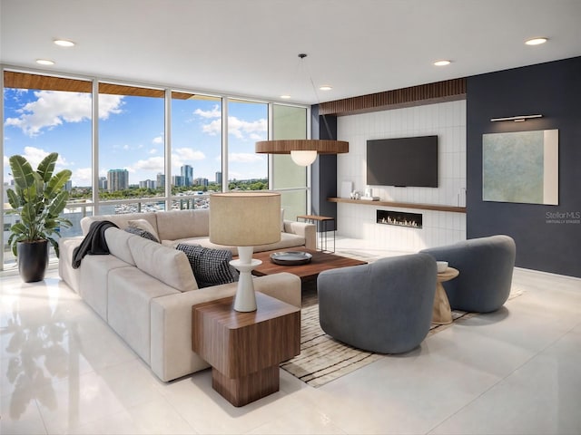 tiled living room with a fireplace and a wall of windows