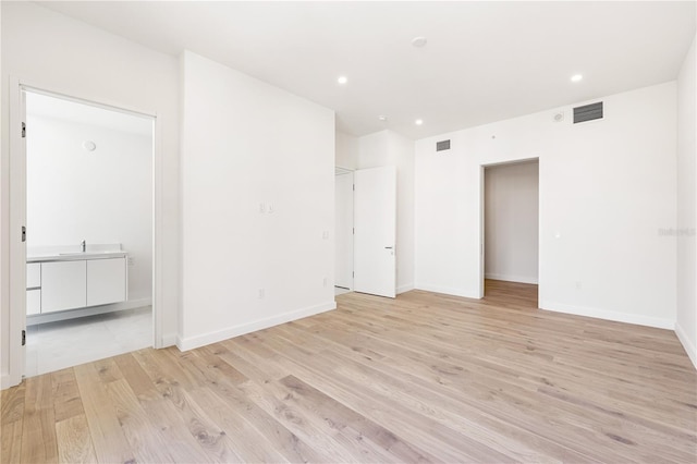 unfurnished room featuring light hardwood / wood-style flooring