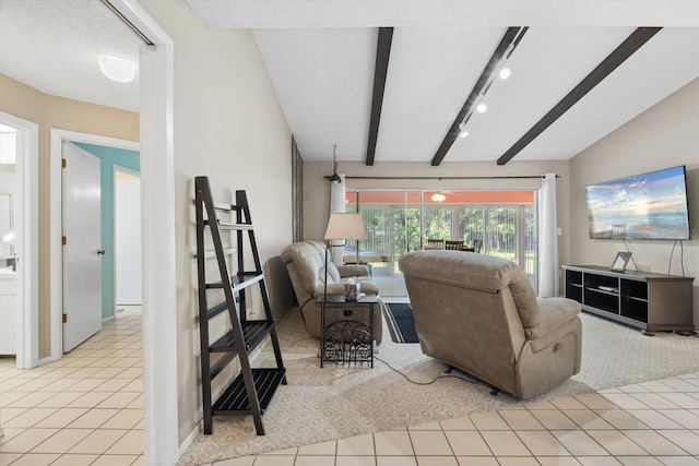 tiled living room with a textured ceiling, track lighting, and lofted ceiling with beams