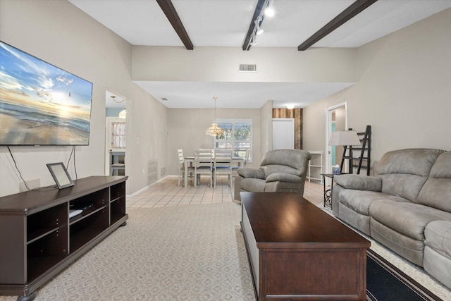 carpeted living room with rail lighting