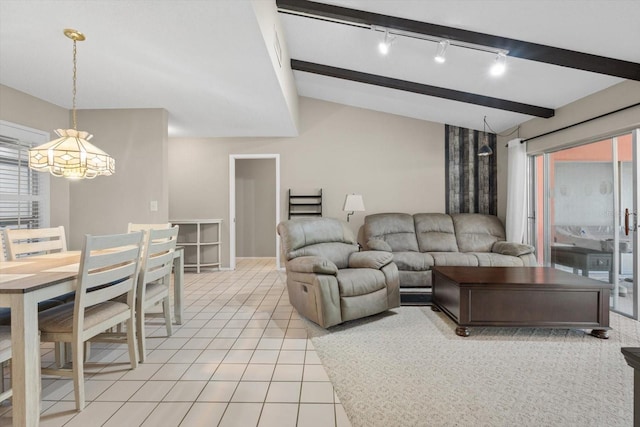 tiled living room featuring vaulted ceiling with beams and rail lighting