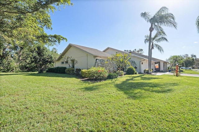 view of home's exterior with a lawn